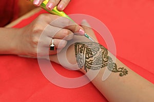 Henna painted hand