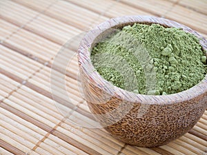 Henna powder in the coconut bowl