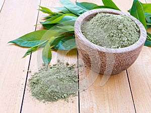 Henna powder pile on the wooden background