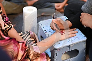 Henna tattoo on bride`s hand in her wedding night