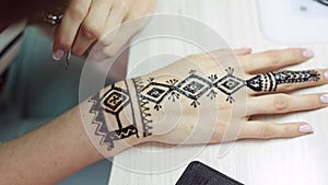 Henna tattoo on women hands