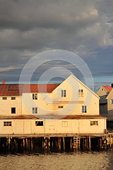 Henningsvaer buildings enlighted by midnightsun