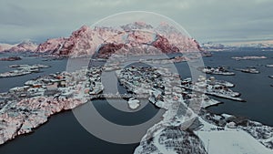 Henningsvaer Horizons: Aerial Symphony of Snow, Sea, and Sunset