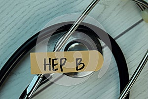 Hep B write on sticky notes isolated on Wooden Table. healthcare Concept photo
