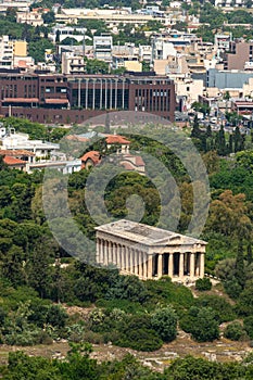Hephaestion is the temple of Hephaestus in Athens on the territory of the ancient Agora. Modern houses around. photo