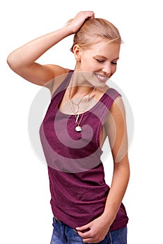 Her attitude embodies freedom. Studio shot of a beautiful young woman standing with her hand in her hair isolated on