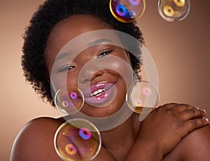 Her beauty will have you feeling like youre floating. Studio portrait of a beautiful young woman looking happy against a