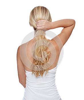 Her hair is her crowning glory. Rearview studio shot of a young blonde woman with long blonde hair isolated on white.