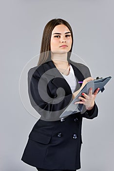 Her skills are in demand. trendy office worker. formal casual fashion style. stylish woman hold office folder. girl