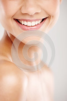 Her smile brightens any day. Cropped closeup of a young woman with great skin and a beautiful smile.
