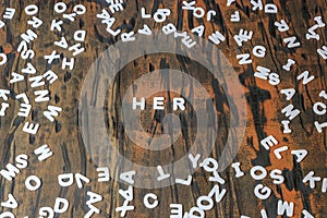 Her spelled in white letters