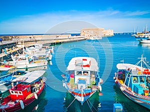 Heraklion, Crete beautiful view to harbor. Heraklion Koule, fortress. Blue sky and turquoise sea at the port of Heraklion city. Co