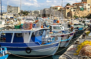 HERAKLION, GREECE - November, 2017: colorful fishing boats near old Venetian fortress, Heraklion port, Crete