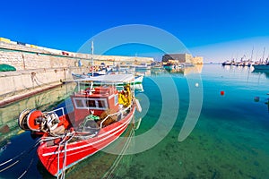 Heraklion harbour with old venetian fort Koule and shipyards. photo