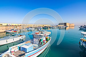 Heraklion harbour with old venetian fort Koule and shipyards. photo