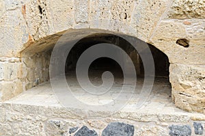 HERAKLION - November, 2017: Embrasure in the stone wall at old Venetian fortress Koule, Heraklion, Crete, Greece.