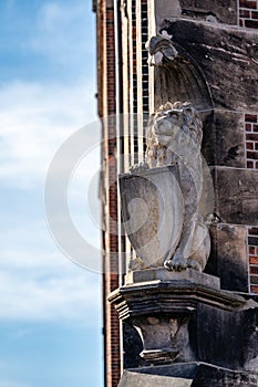 Heraldic lion statue with shield.