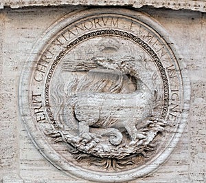 Heraldic salamanders on the facade of Church of St Louis of the French, Rome