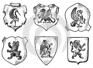 Heraldry in vintage style. Engraved coat of arms with animals, birds, mythical creatures, fish. Medieval Emblems and the
