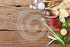 Herb ingredient of Tom Yum spicy soup Traditional Thai food cuisine on wood texture background