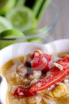 Herb Soya Beans with Minced Shrimp and Pork in Coconut Milk and chili in white bowl