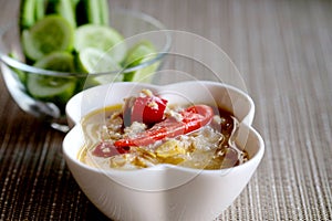 Herb Soya Beans with Minced Shrimp and Pork in Coconut Milk and chili in white bowl