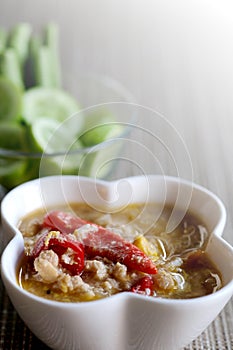 Herb Soya Beans with Minced Shrimp and Pork in Coconut Milk and chili in white bowl