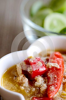 Herb Soya Beans with Minced Shrimp and Pork in Coconut Milk and chili in white bowl