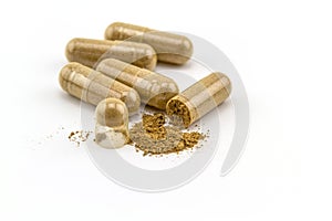 Herbal capsule on white background.