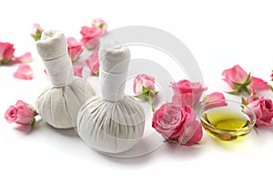 Herbal compress balls for spa treatment with rose flower