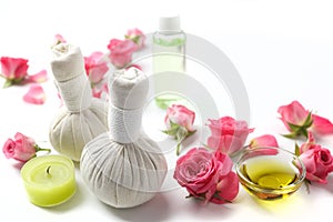 Herbal compress balls for spa treatment with rose flower