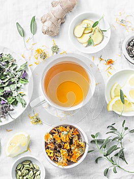 Herbal detox antioxidant tea and the ingredients for cooking on a light background, top view. Herbal homeopathic recipe