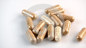 Herbal drug capsules rotate, Alternative medicine concept