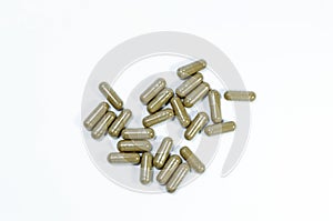 Herbal drugs capsules on top view isolated on white background