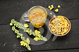 Herbal medicinal tea drink made of Verbascum thapsus, the great mullein, greater mullein or common mullein.