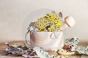 Herbal medicine, homeopathy, the collection of medicinal herbs for tea and medicines. Dried tansy flowers and oak leaves in a