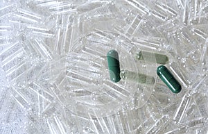 Herbal Medicine on Pile of Empty Capsules