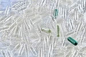 Herbal Medicine on Pile of Empty Capsules