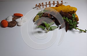 Herbal medicine VS brown Chemical pills isolated medicine the alternative healthy car .Leaf ,medical on white background