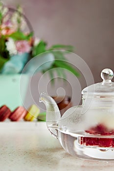 Herbal natural raspberry tea time with macaroons. Cozy home, self care, wellness lifestyle