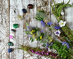 Herbal scrolls and reiki crystals on wooden planks