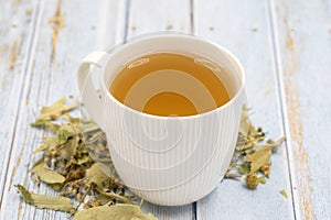 Herbal tea on a blue wood background. linden tea