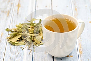 Herbal tea on a blue wood background. linden tea