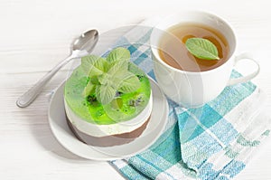 Herbal tea with cake on wooden table