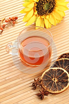 Herbal Tea Cup with Dried Lemon on Wooden Background