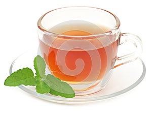 Herbal tea in a cup with tulsi leaves