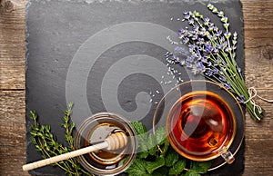 Herbal tea in a glass cup, honey