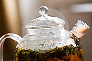 Herbal tea in glass teapot