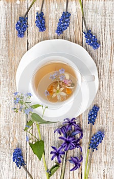 Herbal tea with healing herbs and flowers top view vertical