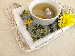 Herbal tea with marigold and cornflower with tea infuser